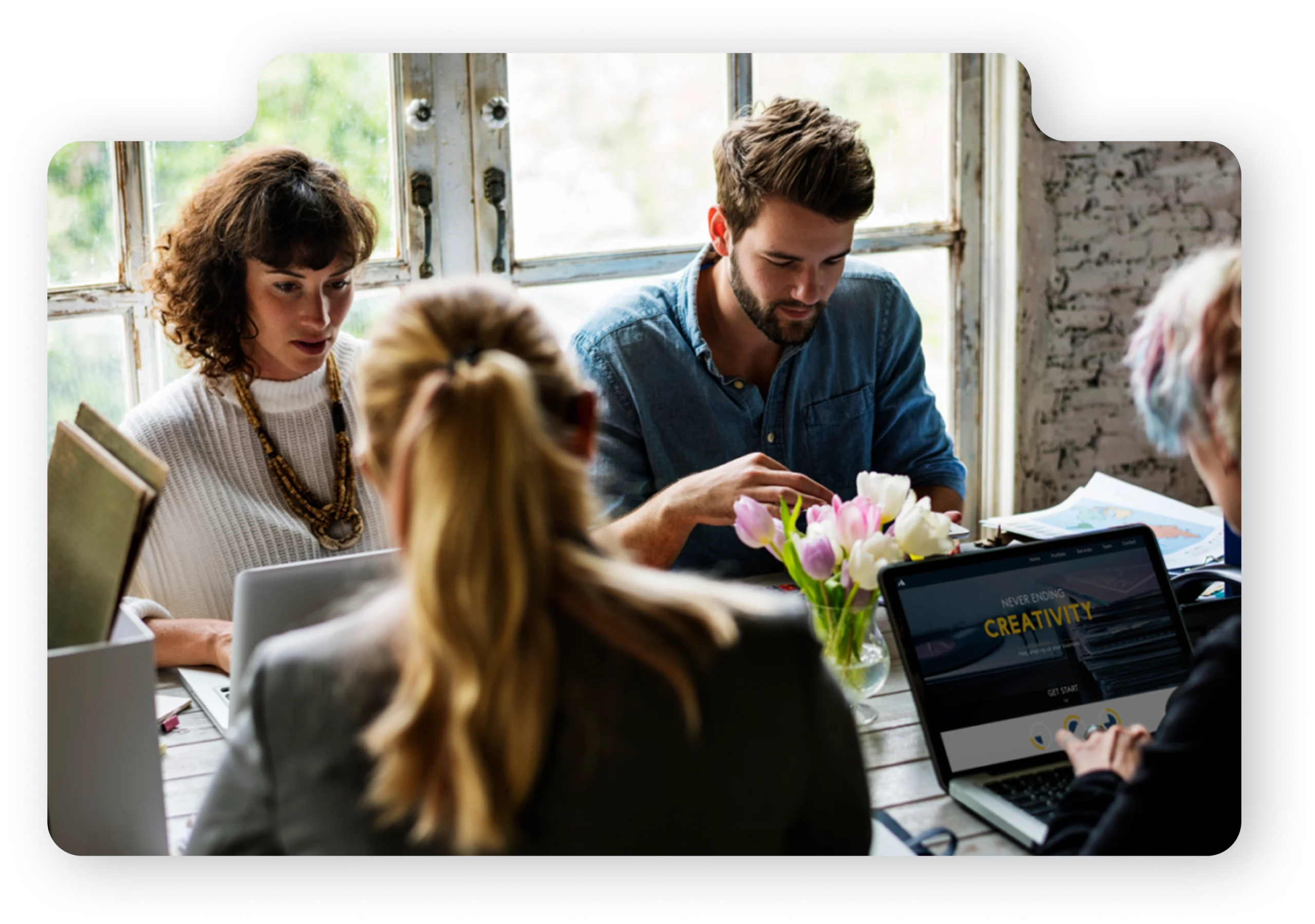 Professional team working together at a desk.